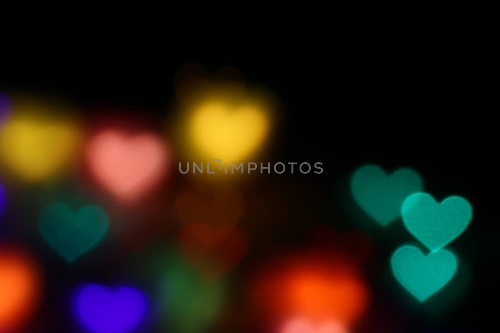 Valentines Colorful heart-shaped bokeh on black background lighting bokeh for decoration at night backdrop wallpaper blur valentine, Love Pictures background, Lighting heart shaped soft night abstract