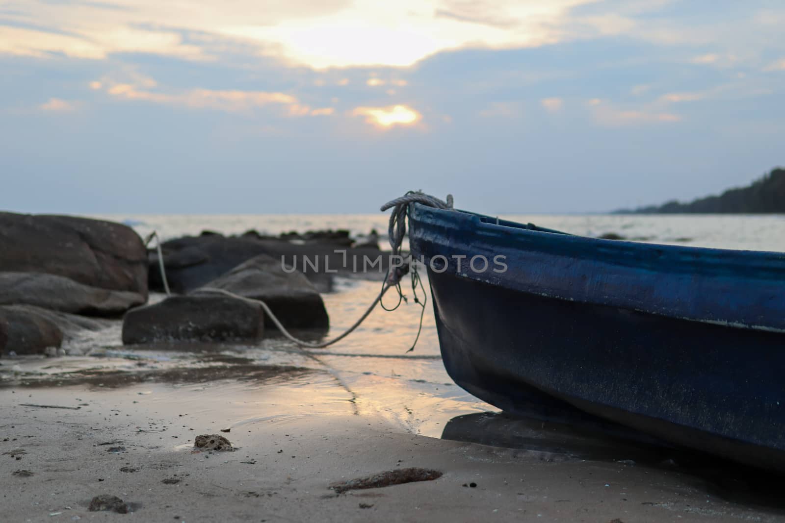 Plastic boat, fishermen at sea Moored at the shore of the beach