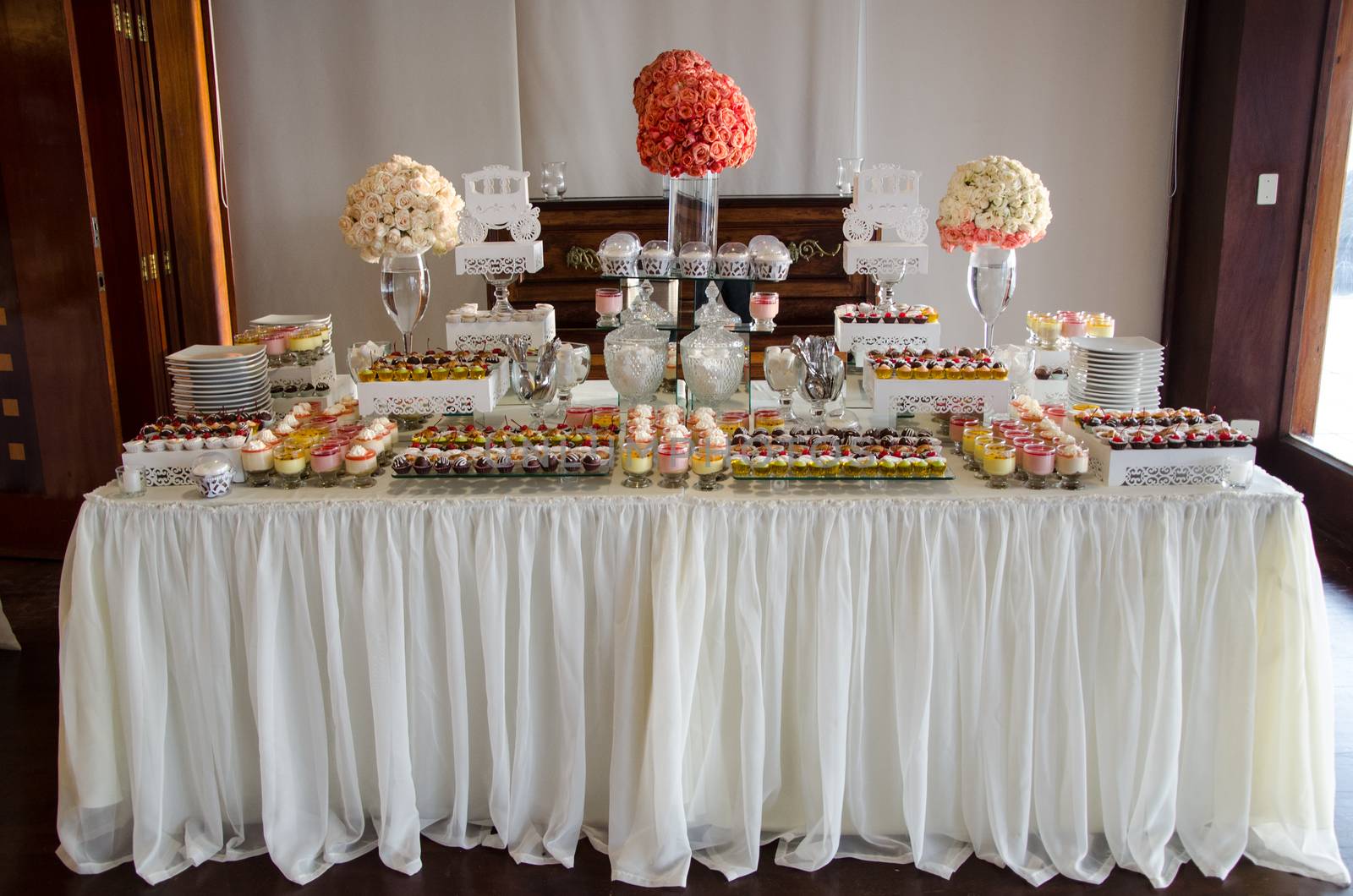 Decorating a candy table at a wedding