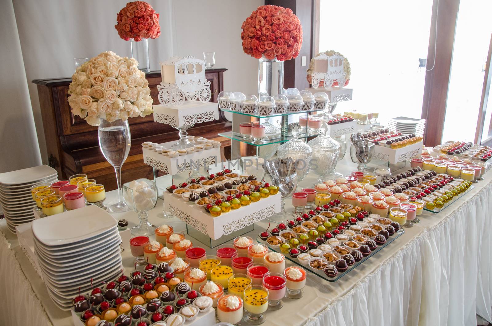 Decorating a candy table at a wedding