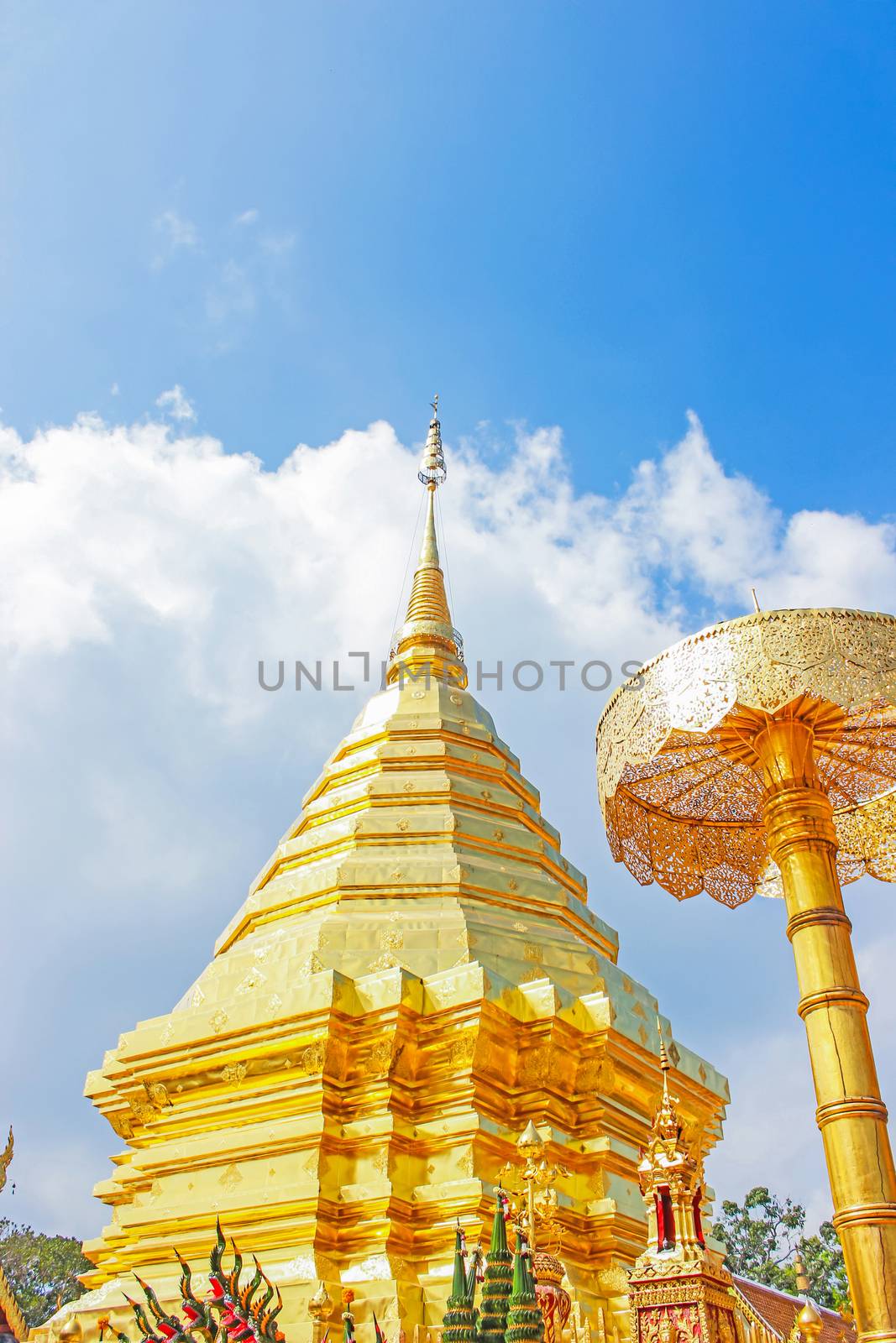 Golden pagoda and umbrella in Wat Phra That Doi Suthep is the popular tourist destination of Chiang Mai, Thailand.