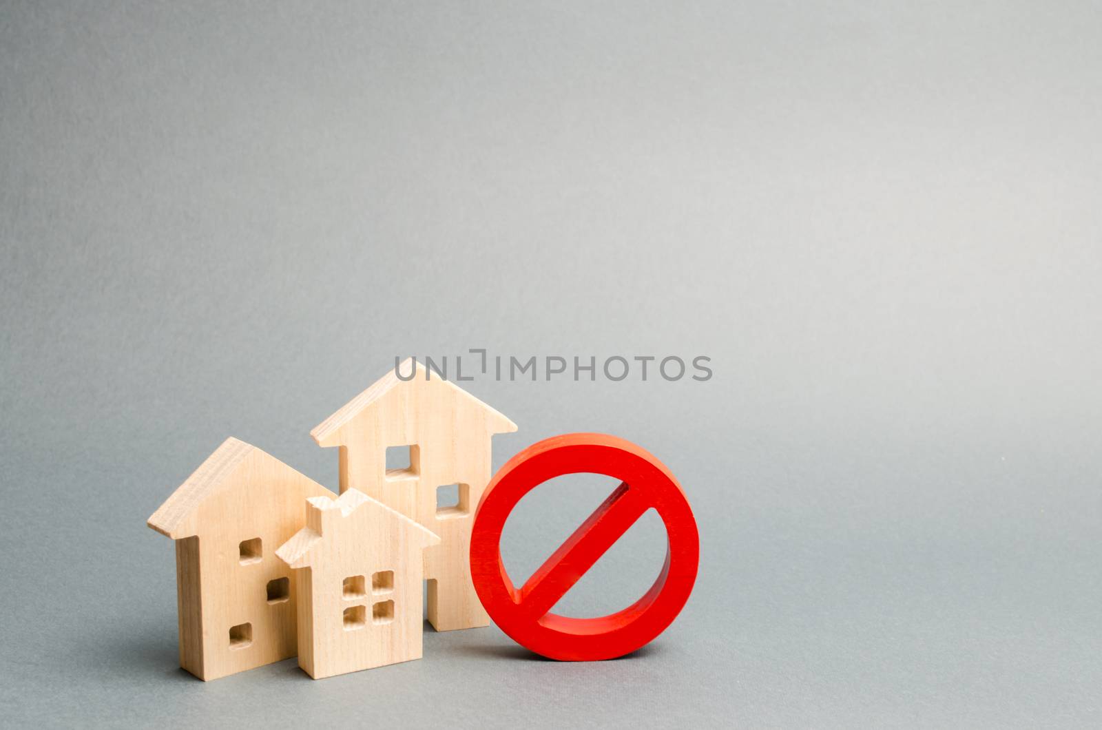 No Sign and the wooden house on an gray background. Unavailability of housing, busy or low supply. Inaccessible and expensive housing. Seizure and freezing of assets by a bank, court. Selective focus by iLixe48