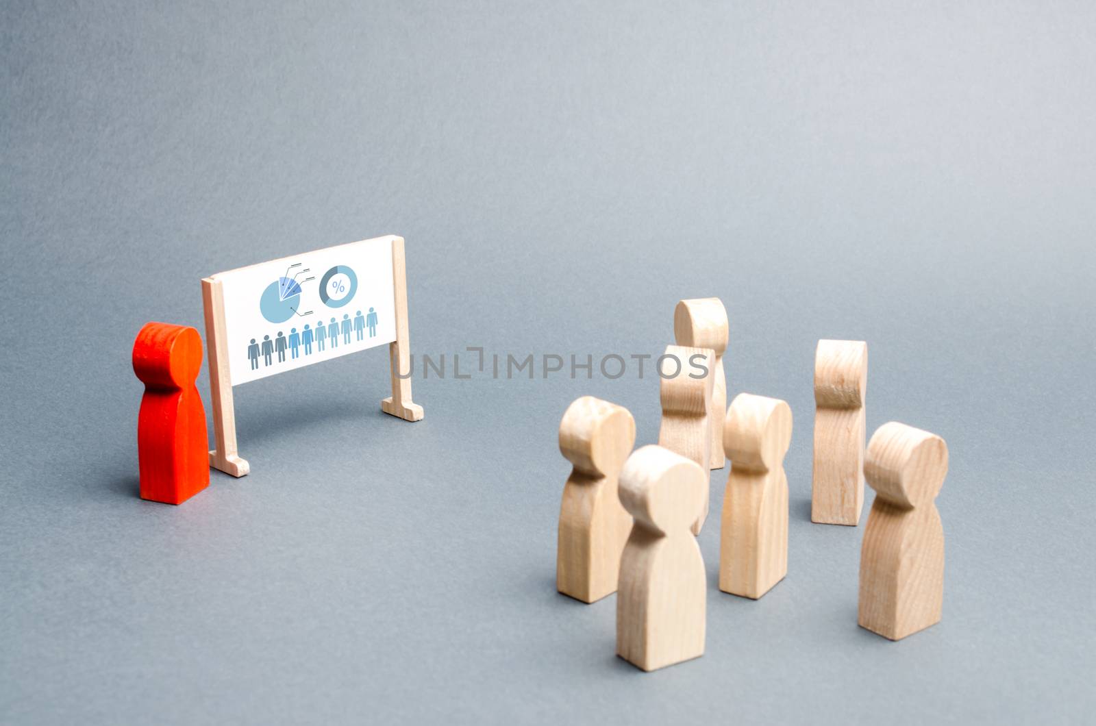 A person holds a presentation to a crowd of people at a briefing, discussion of the business strategy, development of the company. Analysis of the results, information market analysis. Selective focus