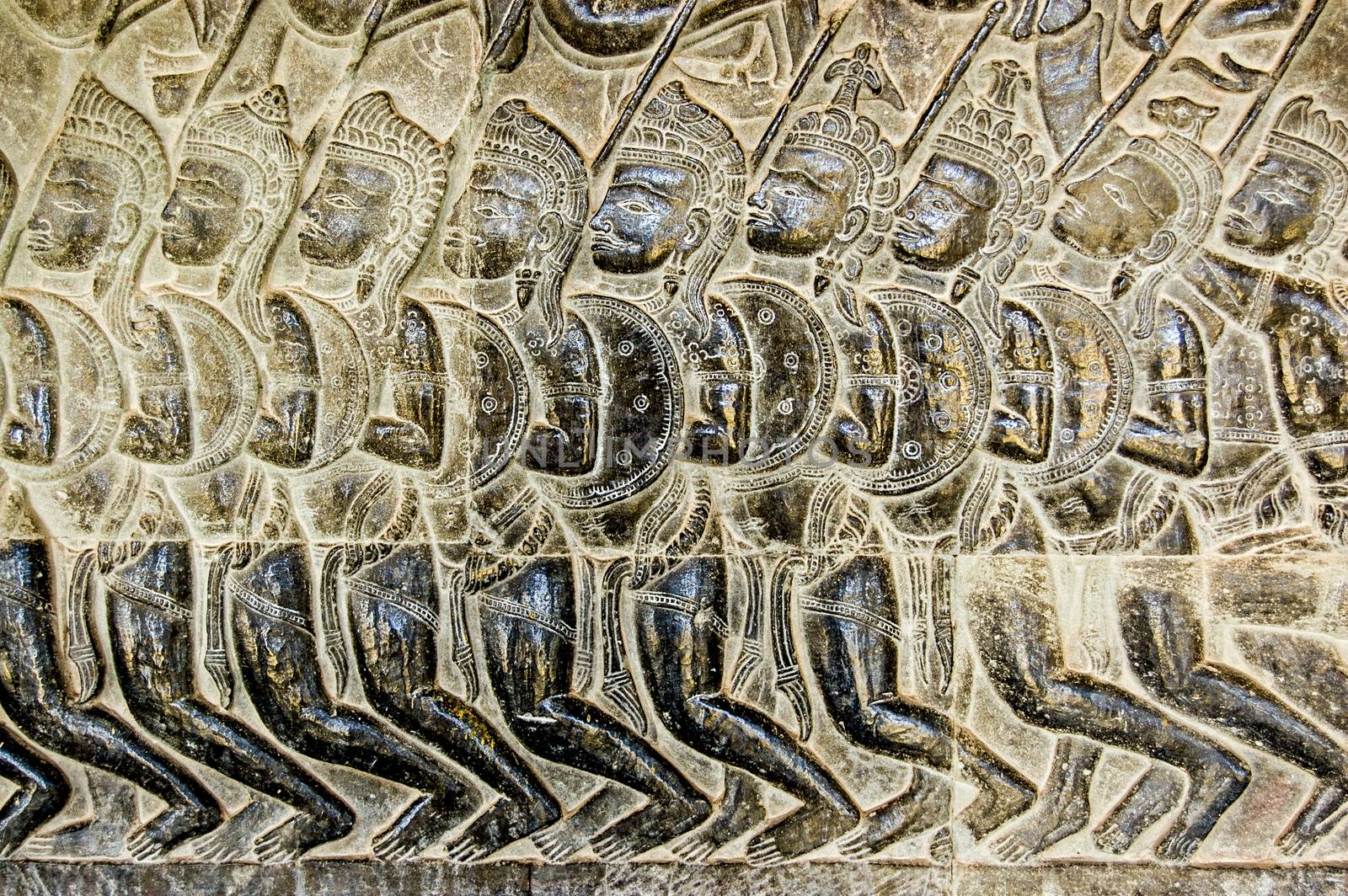 Bas relief of Pandava soldiers marching to the Battle of Kurukshetra as described in the Mahabharata. Eleventh century carving, wall of Angkor Wat temple, Siem Reap, Cambodia.