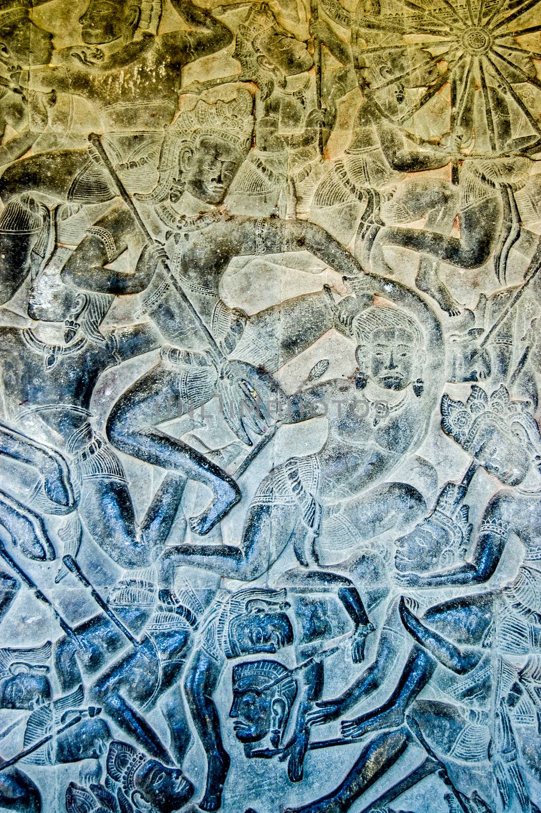 Ancient bas relief carving showing the Hindu god Kama on the side of the Kauravas at the Battle of Kurukshetra. Eleventh century carving, Angkor Wat Temple, Siem Reap, Cambodia.