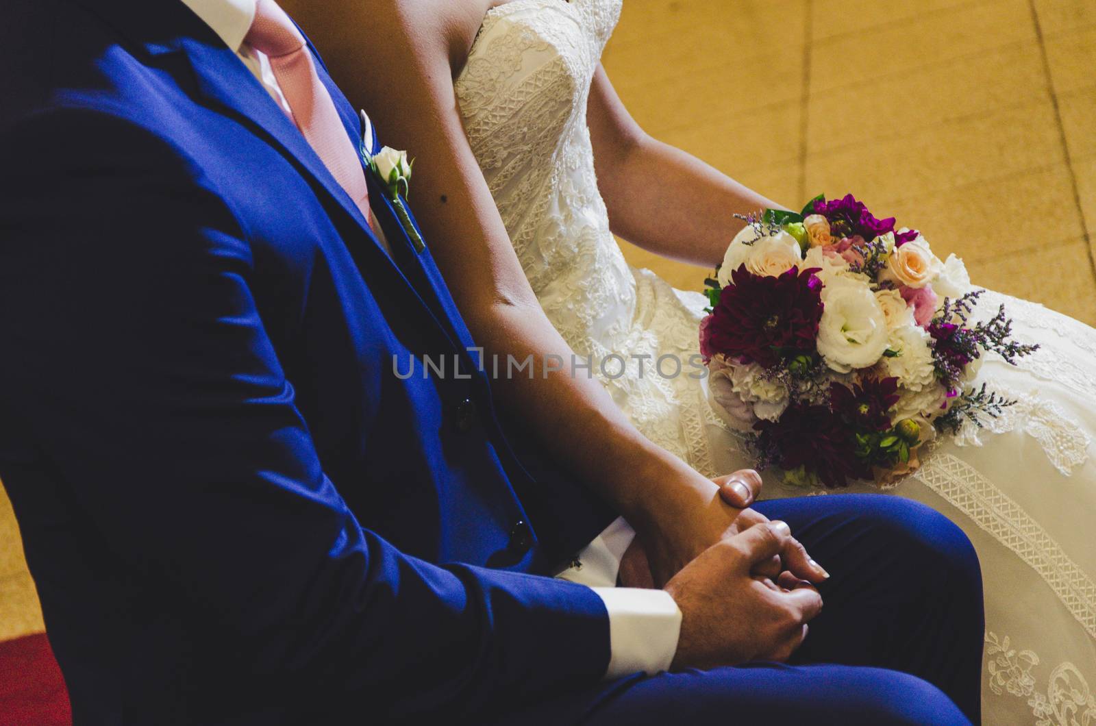 Bride and groom holding hands before getting married