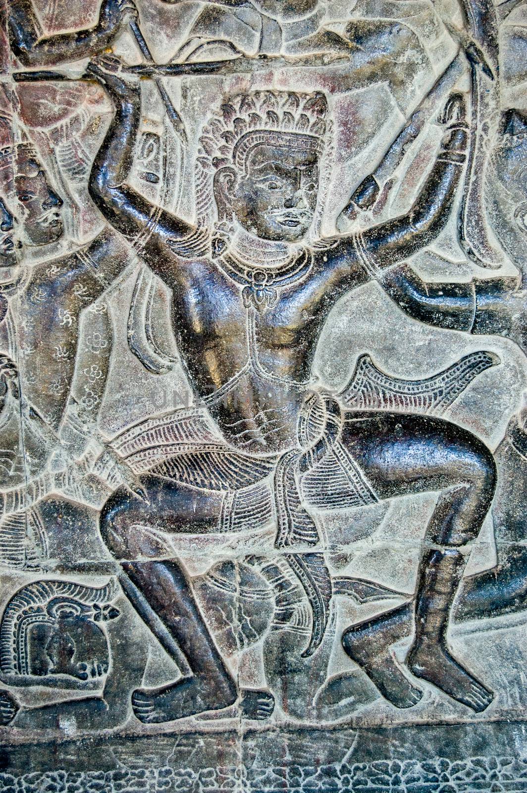 Ancient Khmer bas relief of Kauravaa soldier holding spear in the Battle of Kurukshetra. Wall of Angkor Wat Temple, Siem Reap, Cambodia.