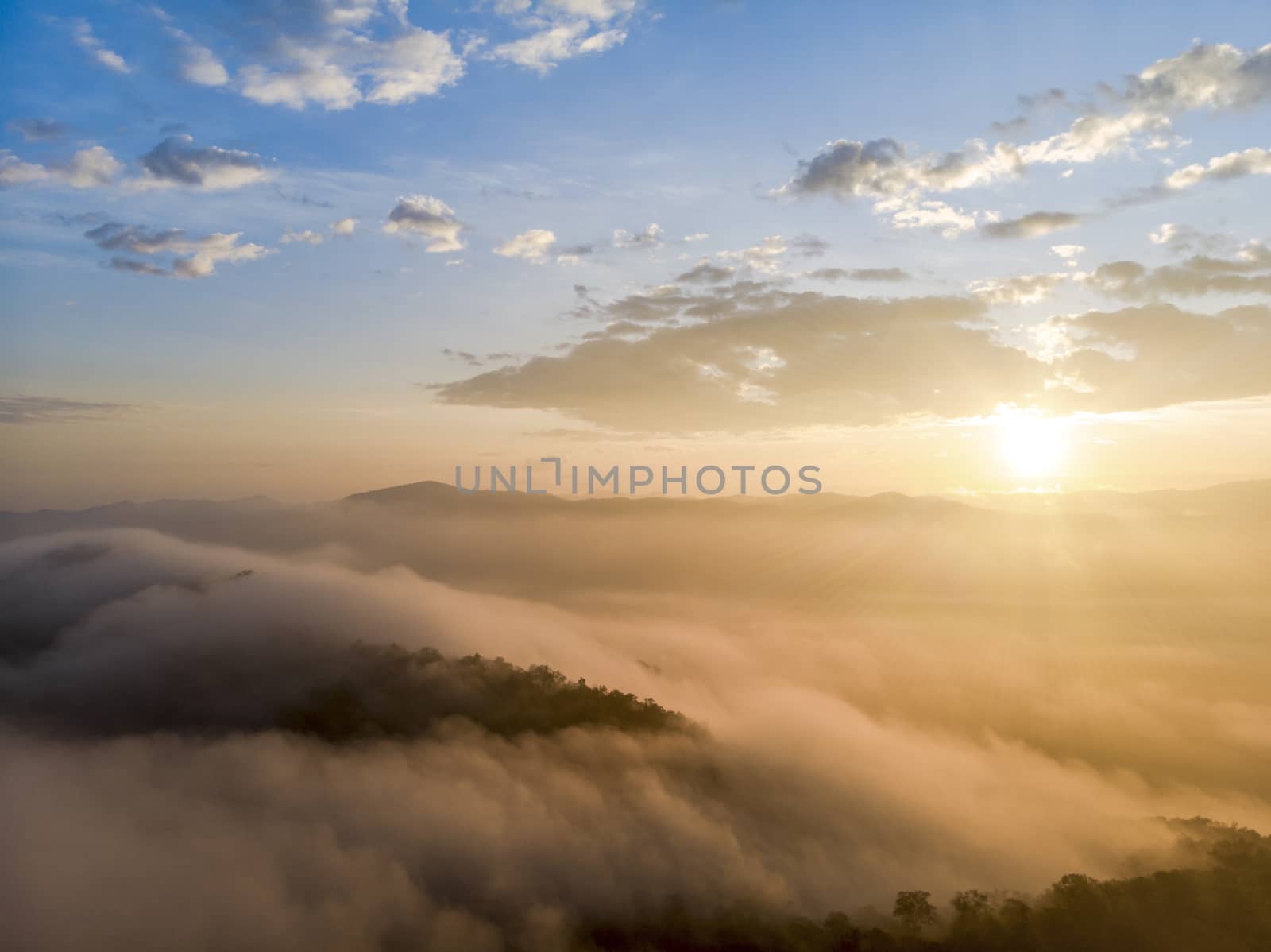 Aerial view forest in morning fog mist, breathing mountains, Sunshine on The Morning Mist.