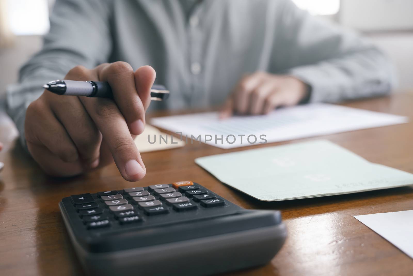 Closeup accountant using calculator. by ijeab