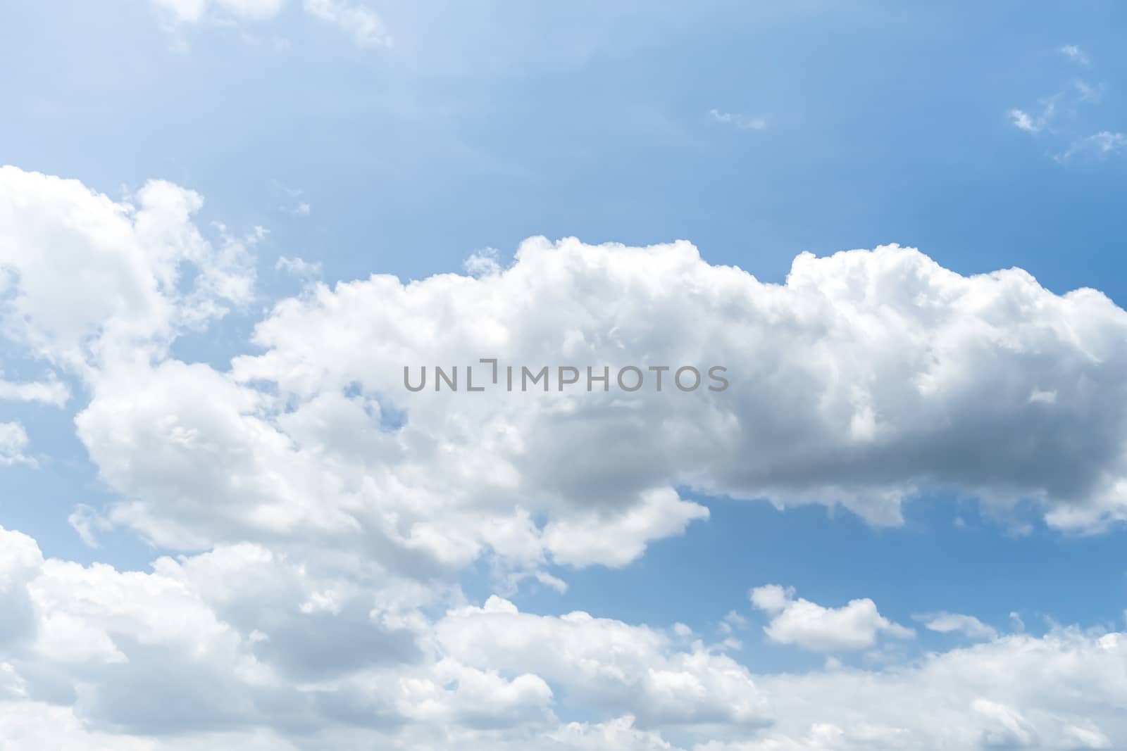 Blue sky background with clouds, The cumulus level cloud level is 8,000-20,000 feet beautiful by nature, white fluffy clouds In sunny summer.