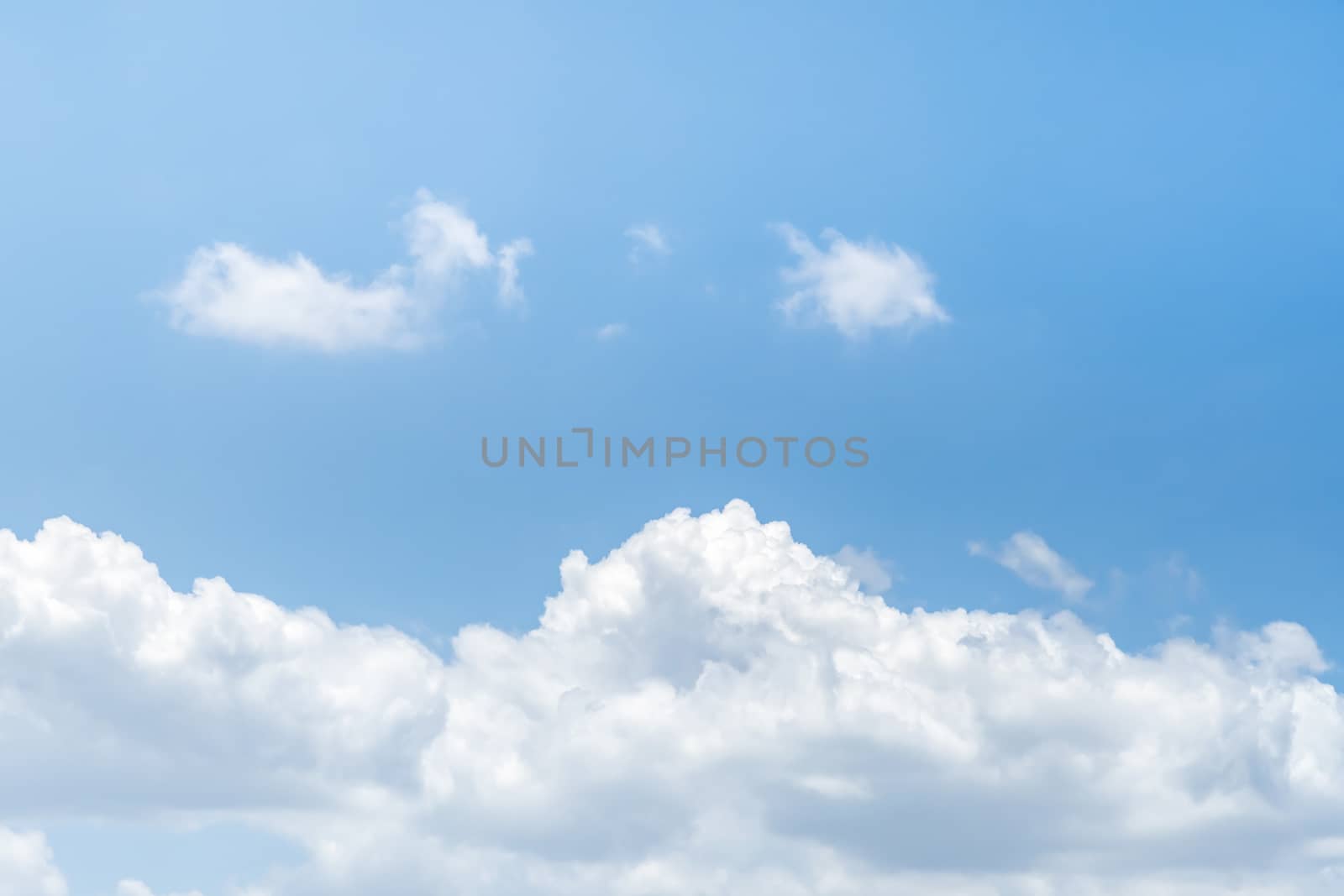 Blue sky background with clouds, The cumulus level cloud level is 8,000-20,000 feet beautiful by nature, white fluffy clouds In sunny summer.