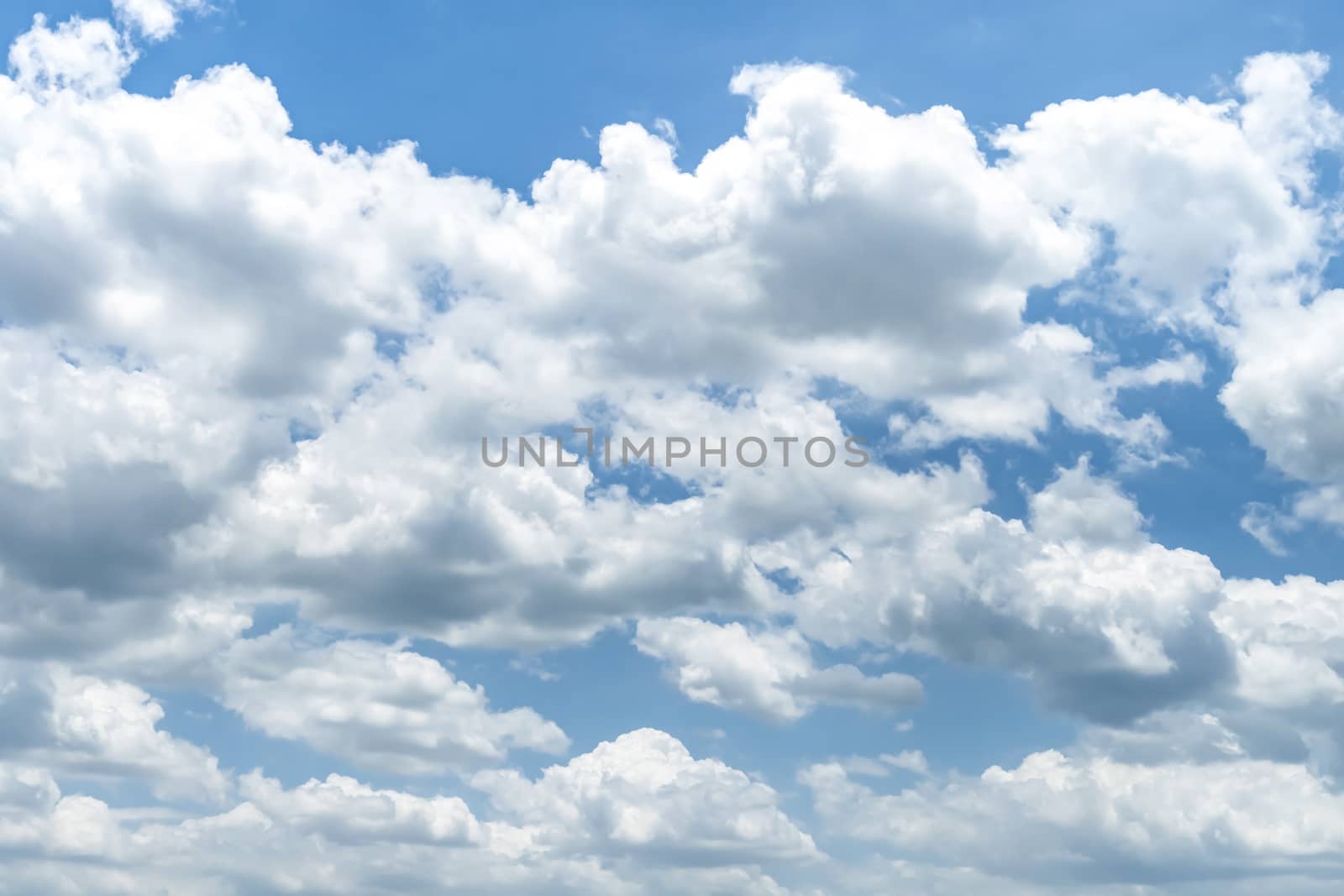 Blue sky background with clouds, The cumulus level cloud level is 8,000-20,000 feet beautiful by nature, white fluffy clouds In sunny summer.