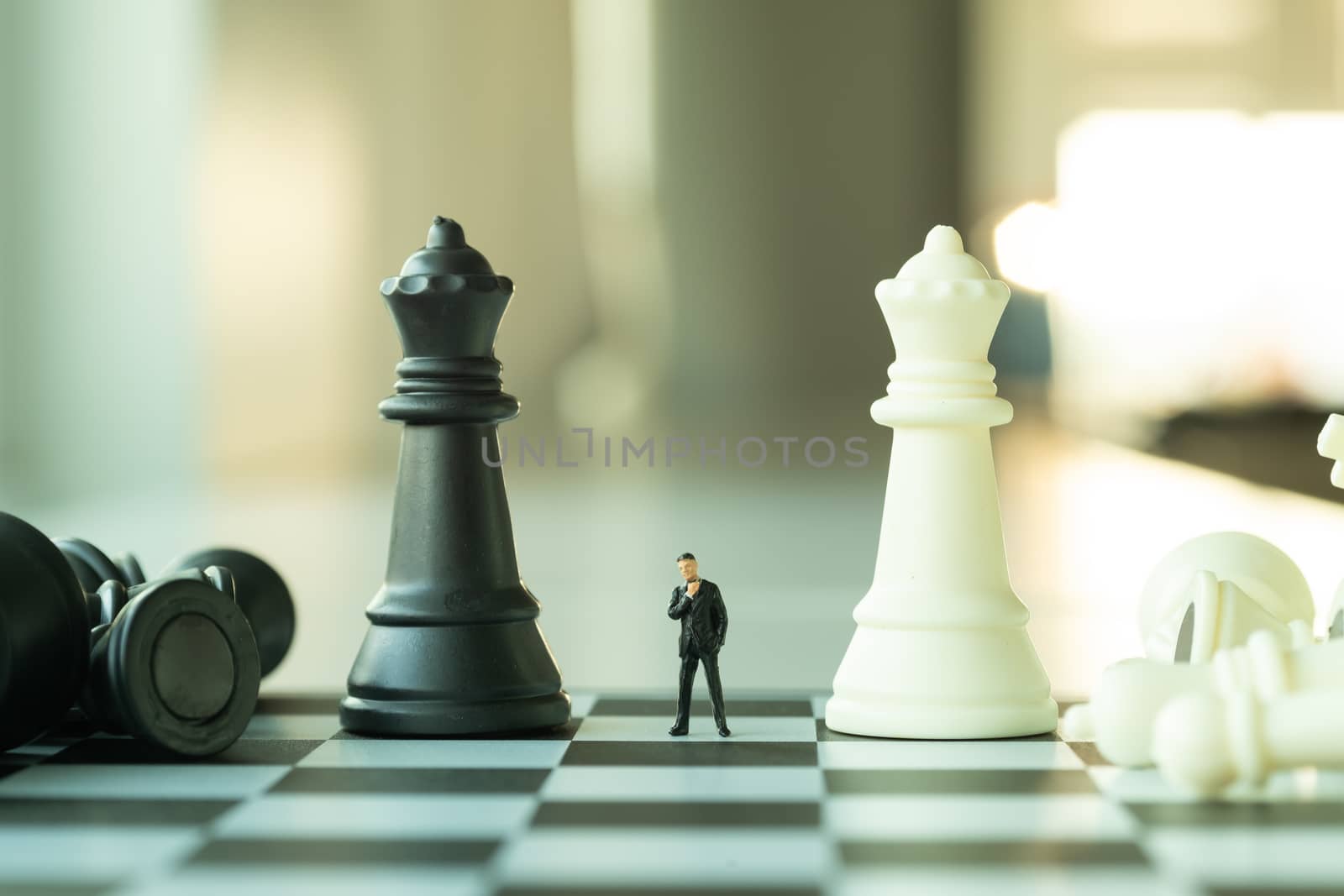 Business planning concept. Small businessman figure standing and by Toefotostock