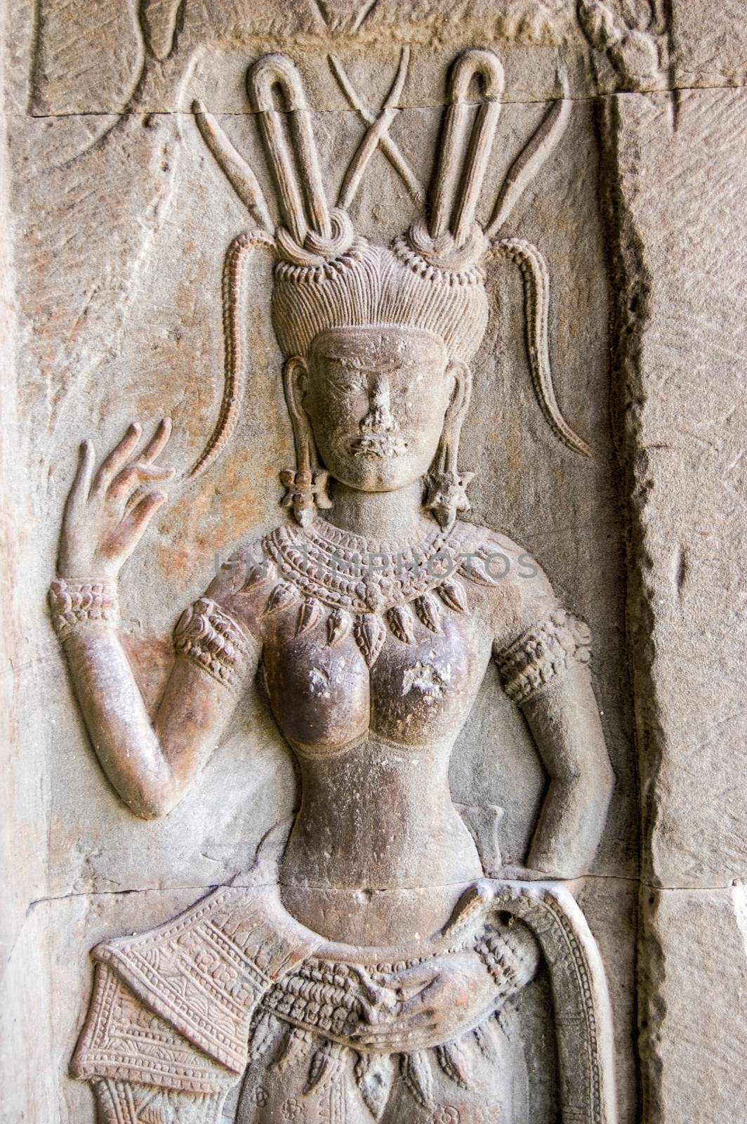 Stone carving of an Apsara Dancer, northern gallery, Angkor Wat temple, Siem Reap, Cambodia.
