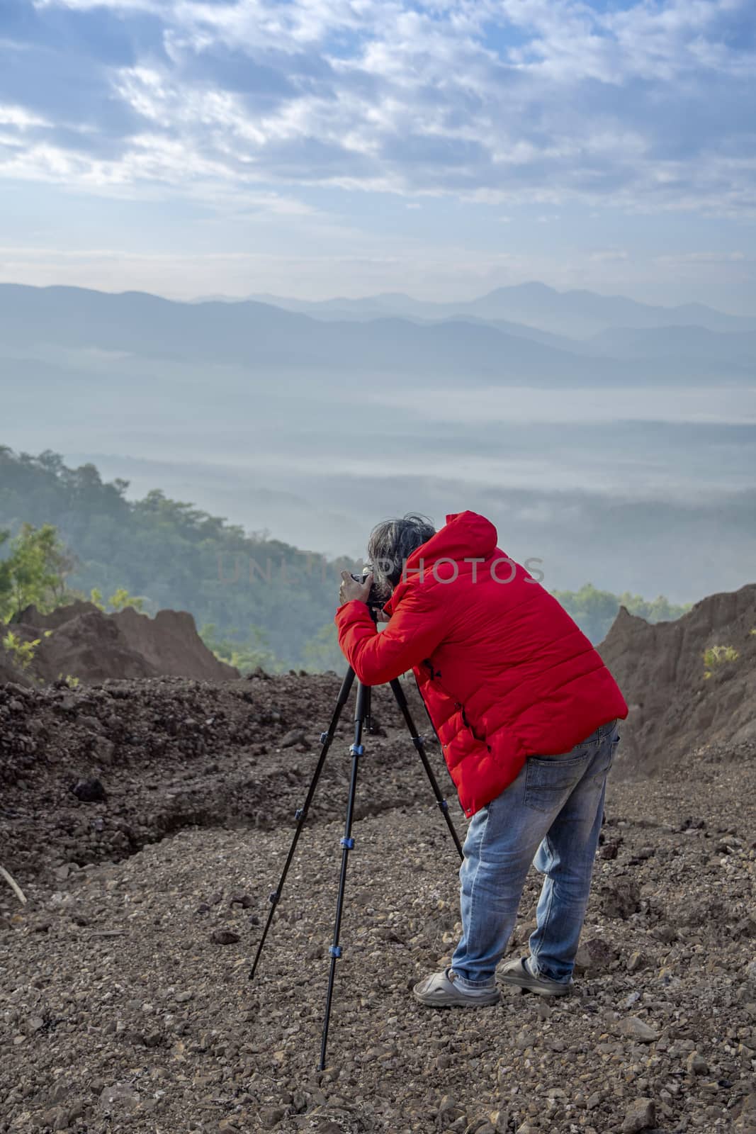 Nature photographer traveler taking photo of beautiful landscape by Aedka_Stodio