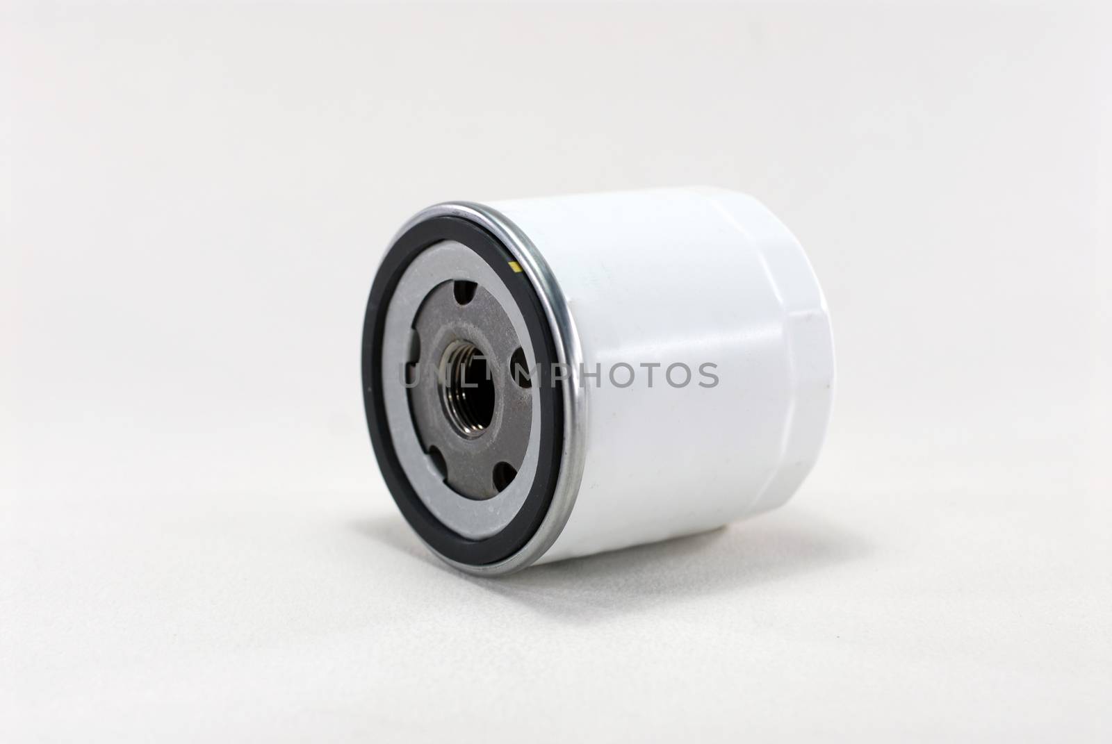 Oil filter enclosed in a metal housing