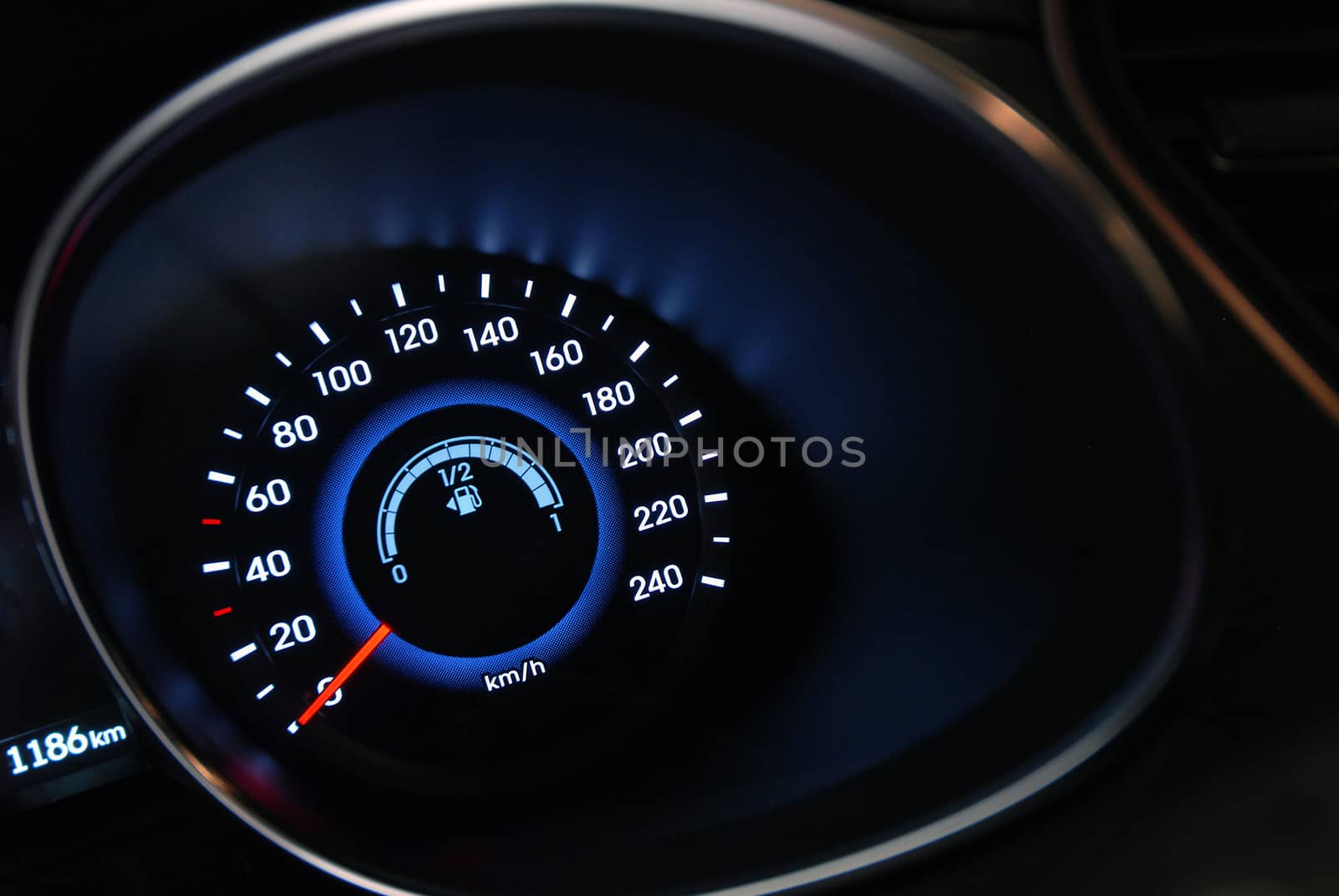 A shot of the car dashboard glowing while stationary