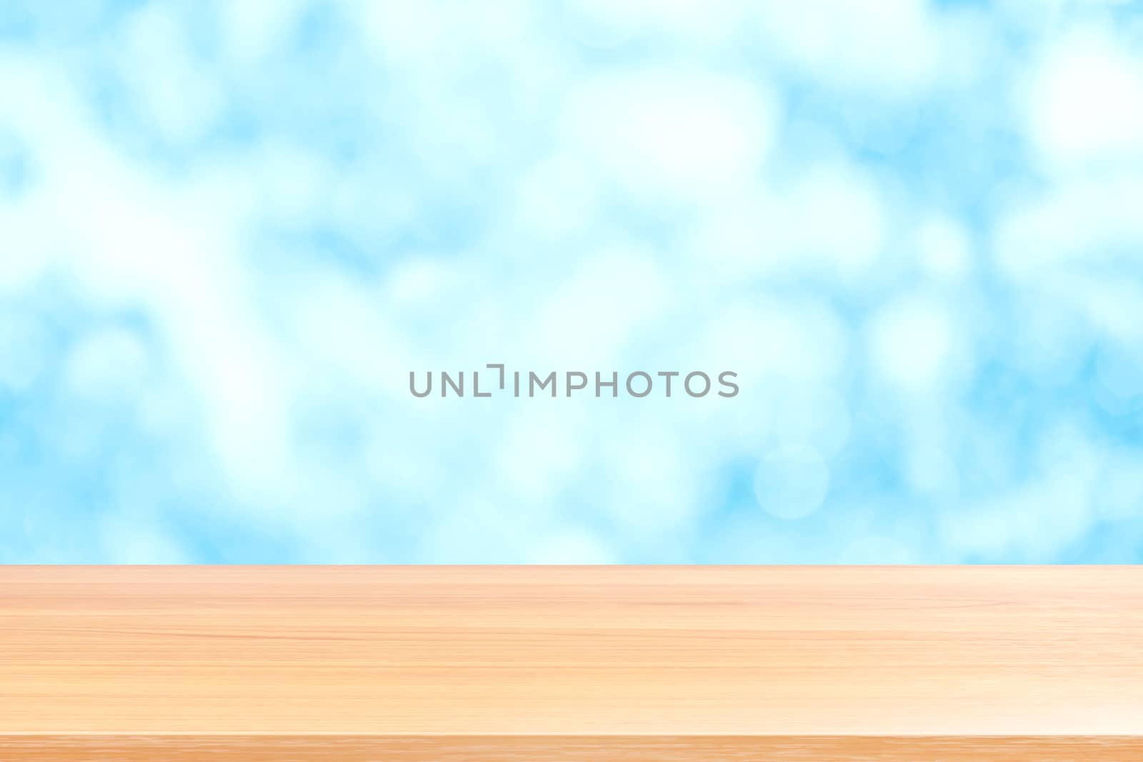 wood plank on blurred blue bokeh sky soft texture background, empty wood table floors on soft bokeh blue soft colorful light, wood table board empty on blue soft texture background