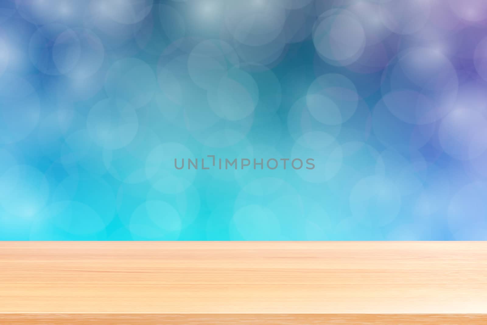 empty wood table floor on blurred bokeh soft blue gradient background, wooden plank empty on blue bokeh colorful light shade, colorful bokeh lights gradient blue soft for banner advertising products