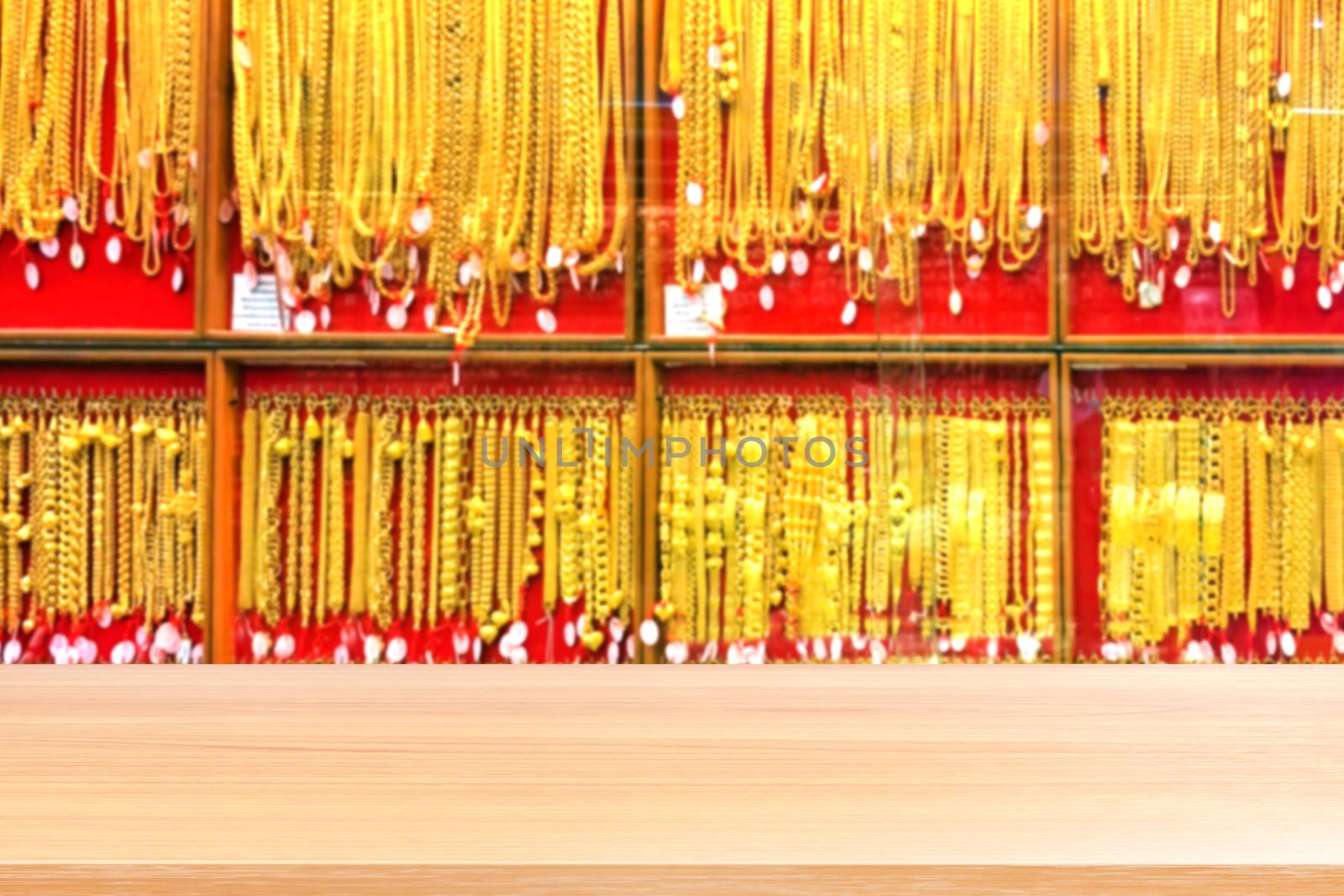 wood plank on blurred gold background blurred, empty wood table floors on panel gold shop jewelry store for seller recommend products and gold showcase, wood table board empty front gold shop wall