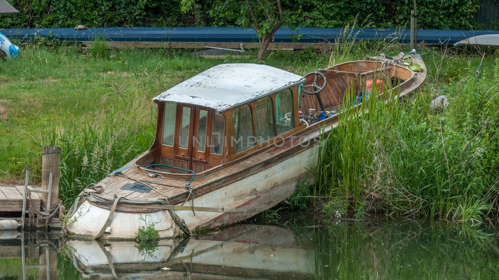 old abandoned boat on the river bank in bath england by sirspread