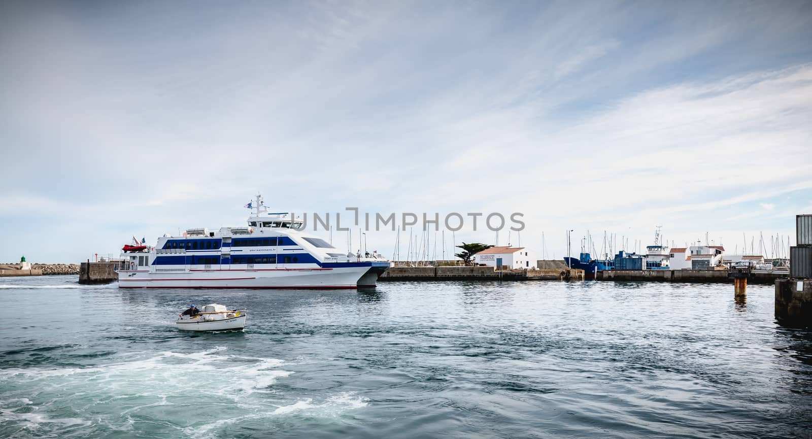 ferry that enters the harbor of the island of Yeu, France by AtlanticEUROSTOXX