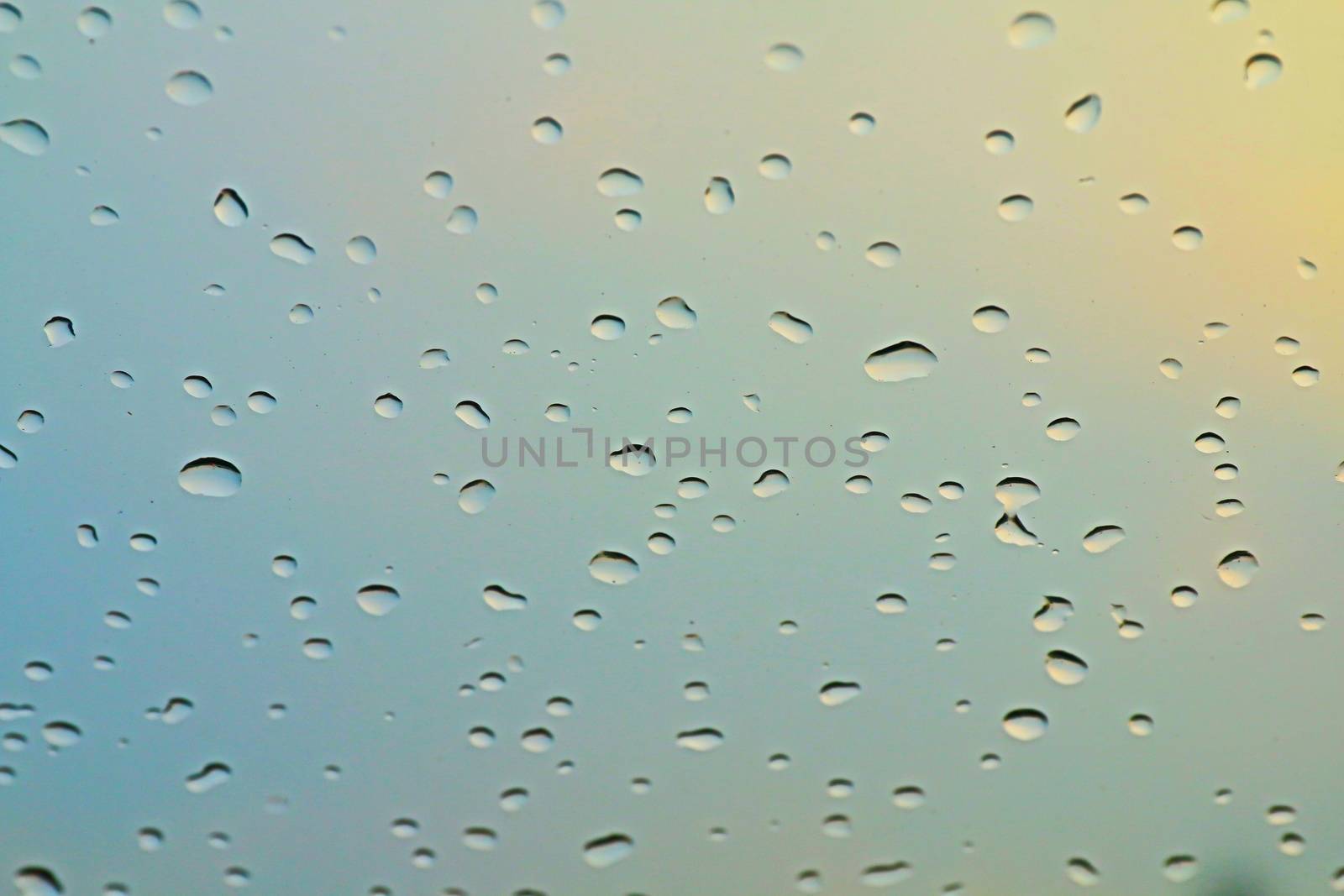 water rain drop on soft blue nature glass for abstract fresh background