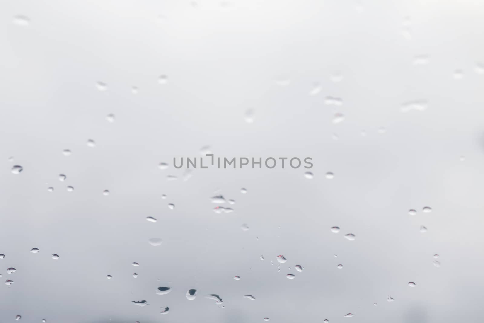 Blurred background water rain drops on glass windows, White Background rain cold