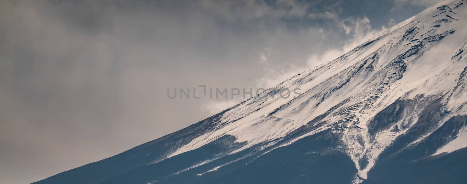 Close up top of Fuji mountain with snow cover on the top with co by sirawit99