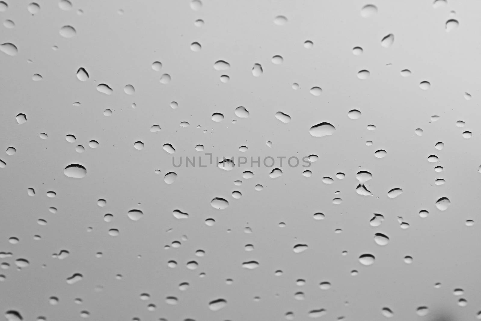 water rain drop on soft blue nature glass for abstract fresh background