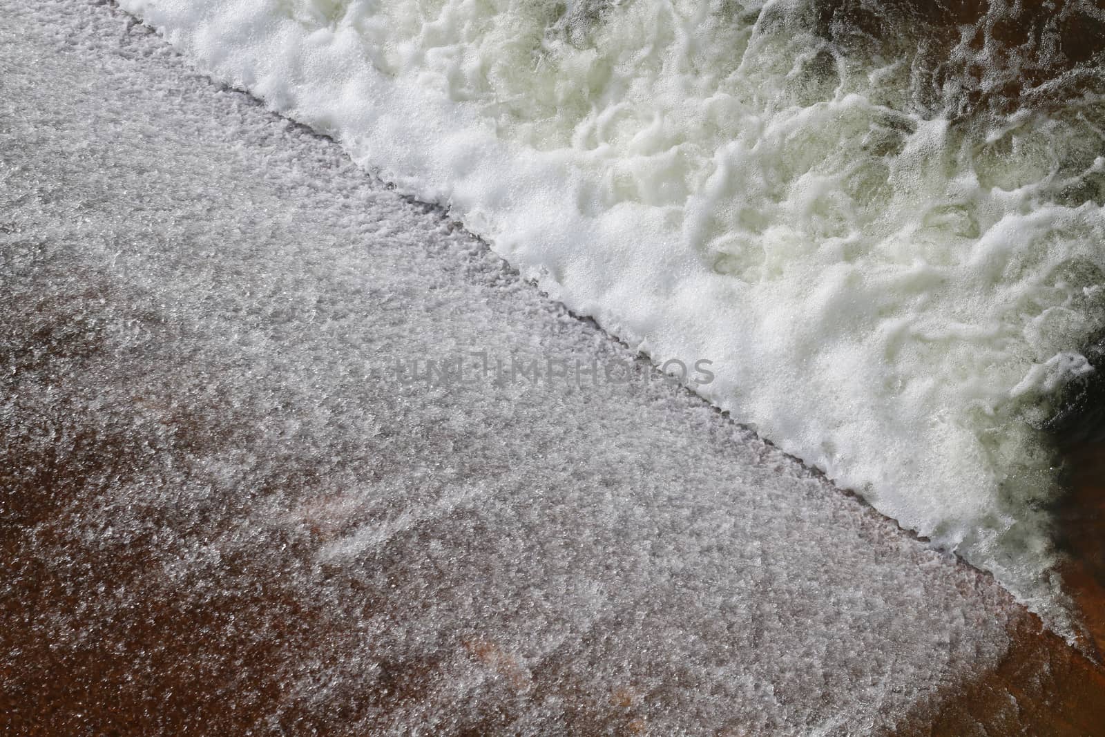 Dam water flow, Surface flow, Flowing water at Small water reservoir, Rural water retention dam, splash, Sponge spray