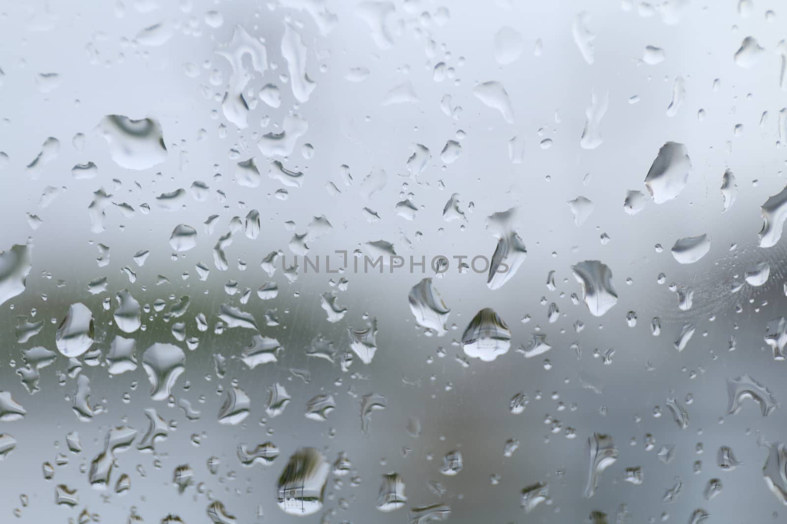 rain, water drop on glass window and rain condensation rainy storm season