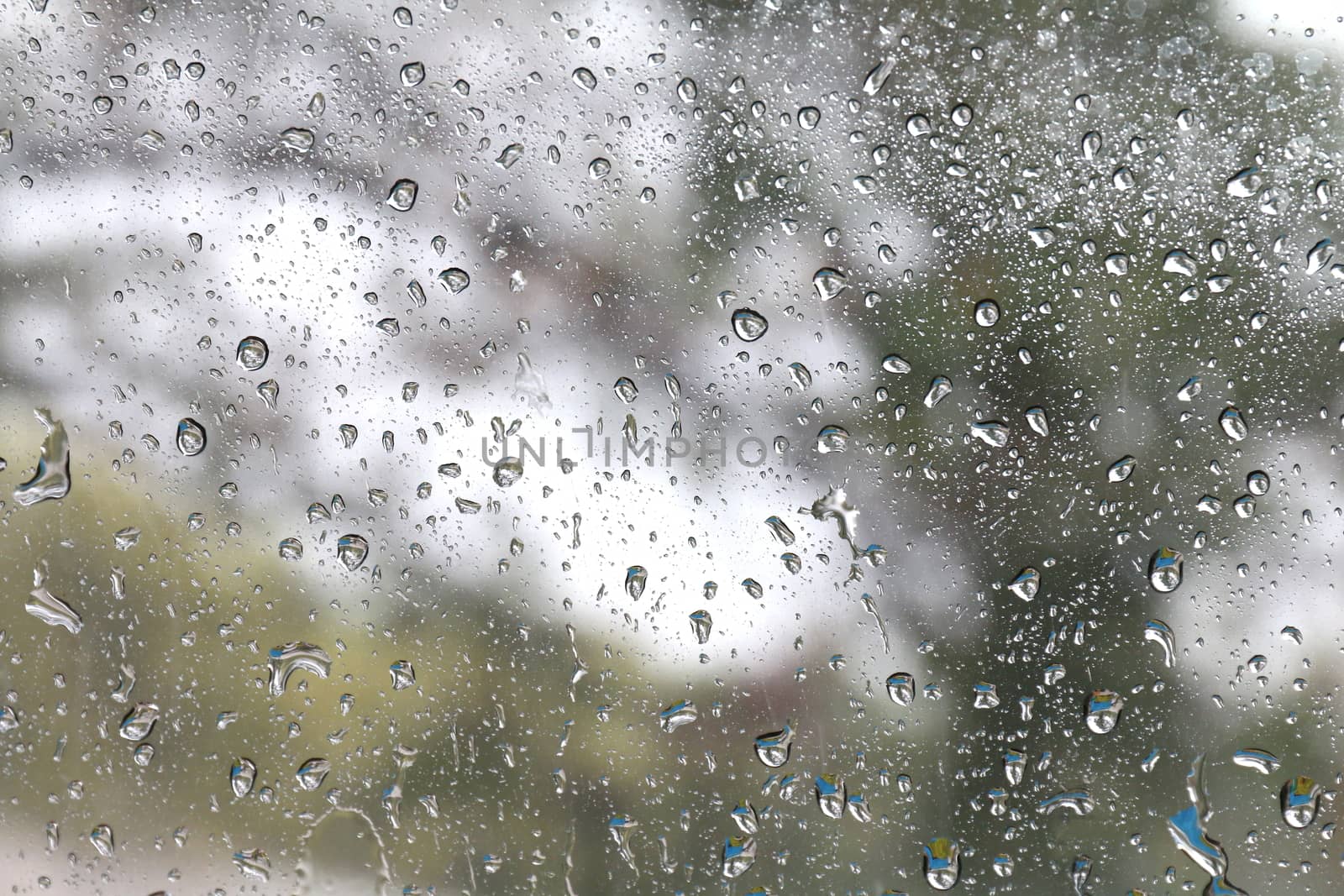 Nature fresh wet background with water raindrops transparency on glass window mirror glass
