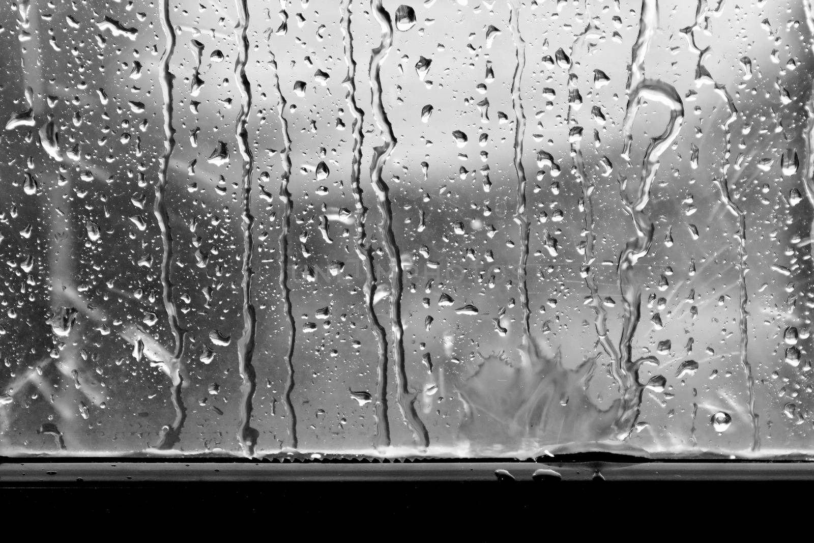 rain, raindrop on window glass fresh for background