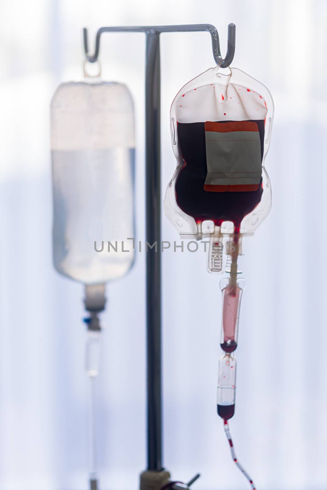 Spare blood bags from laboratory medical hanging on a steel pole by sandyman