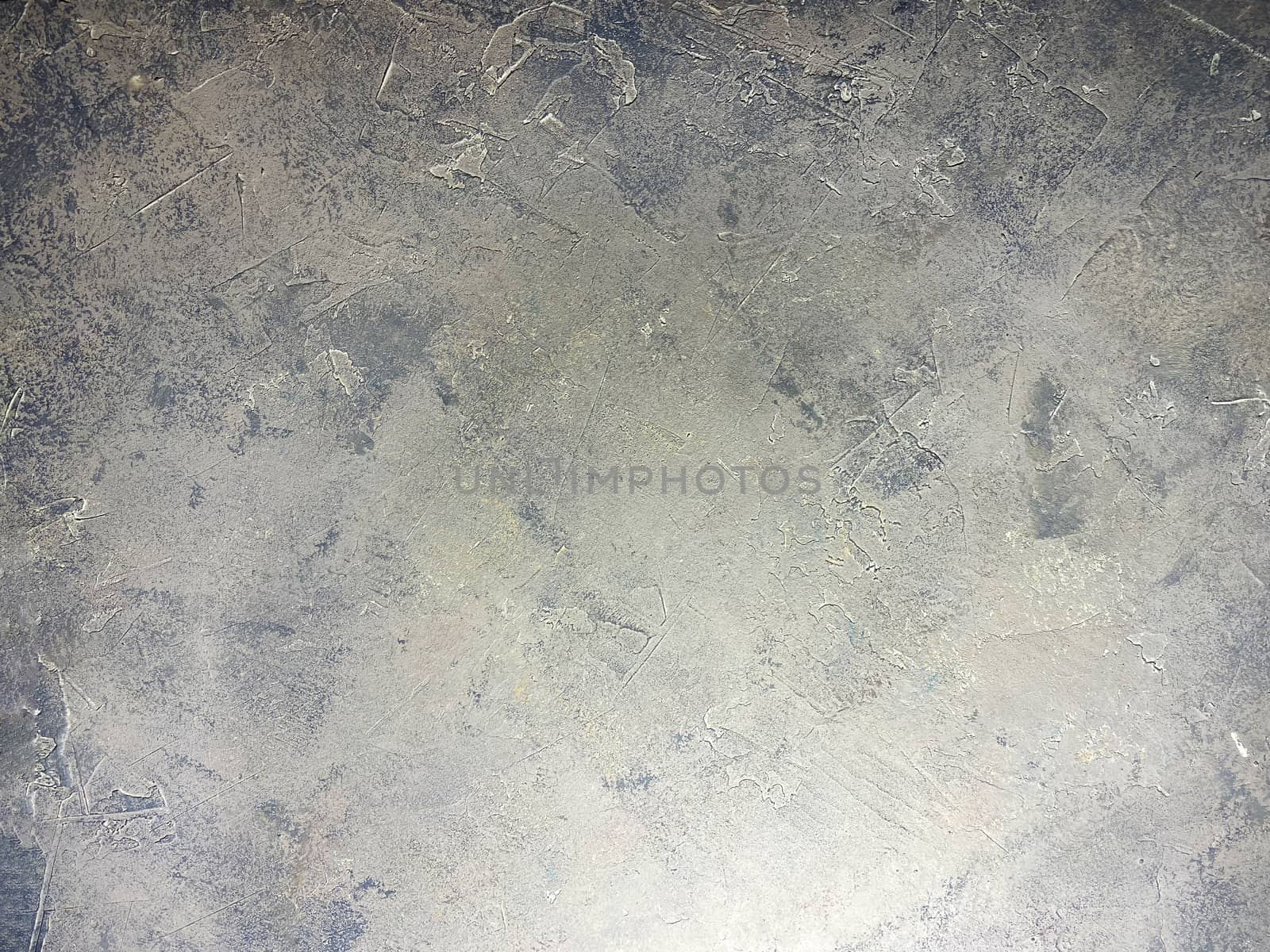 Concrete beige gray background with scuffs and gray splashes. Textured wall texture in the grunge style.