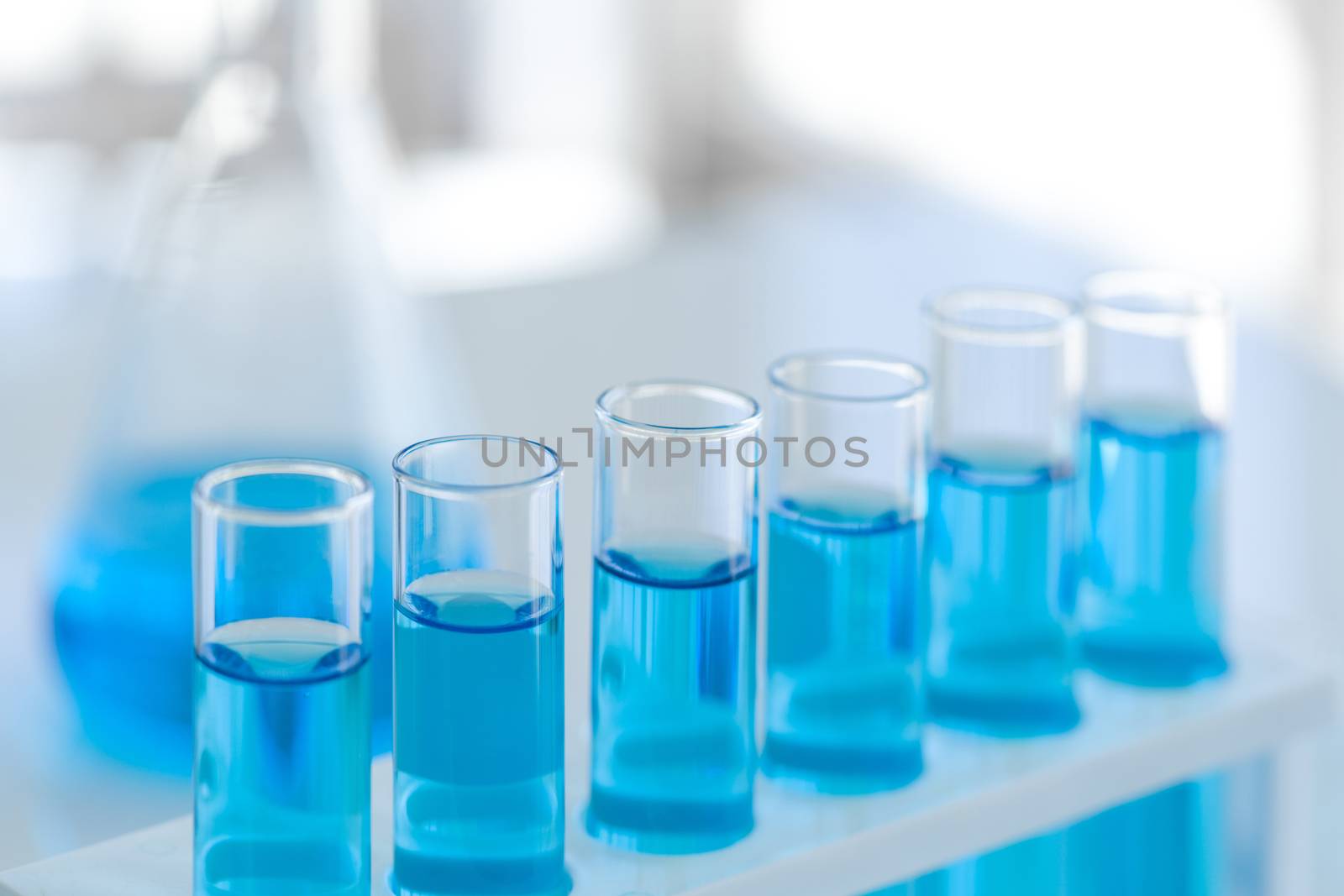 Closeup test tube in chemical laboratory background, science laboratory research and development concept.
