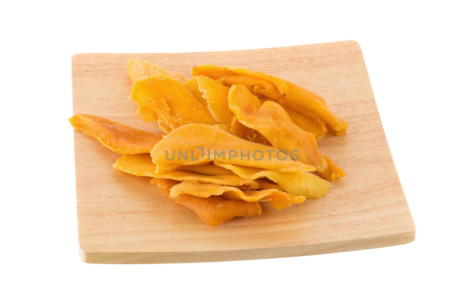 Dried mango fruit slices In a wooden tray isolated on white background.