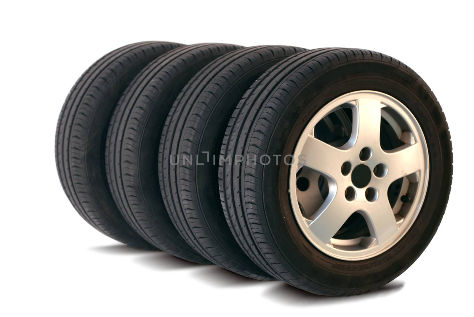 four summer tires isolated on white background