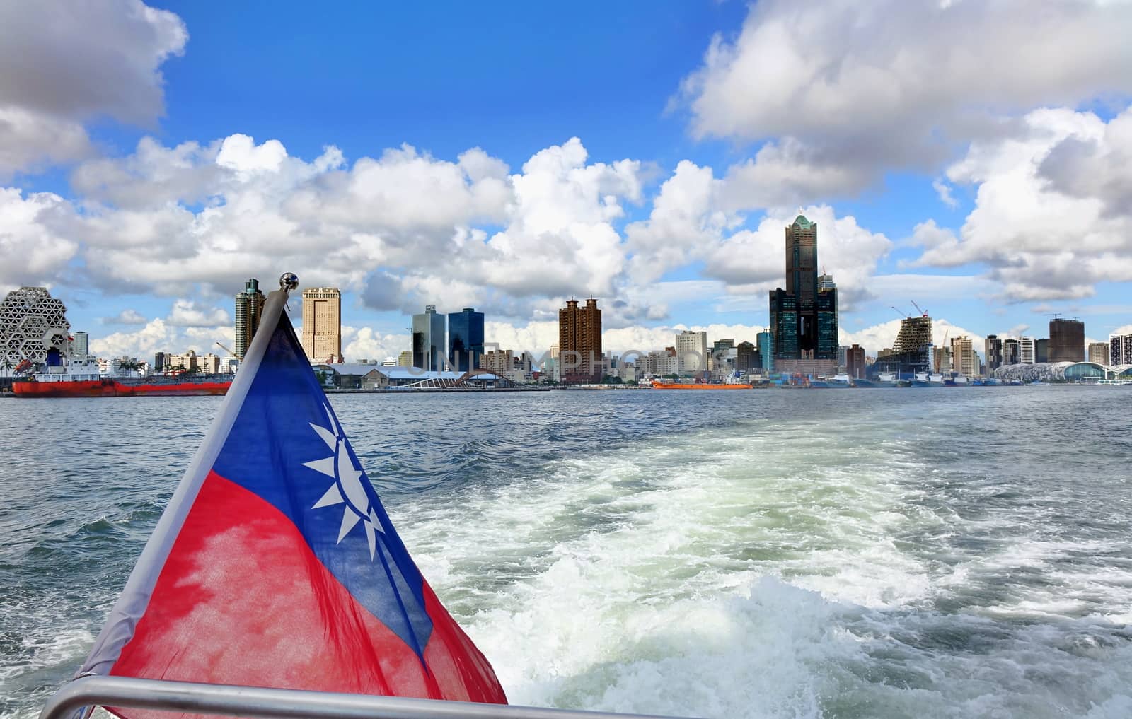 The skyline of Kaohsiung City in Taiwan seen from a boat
