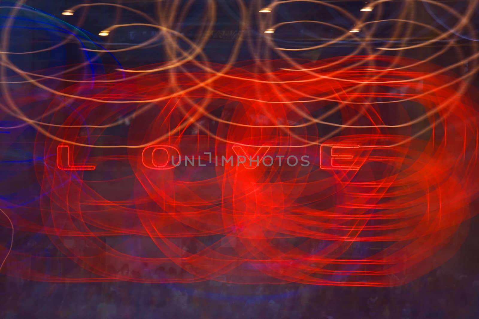 Light painting with the illuminated word LOVE and blurs