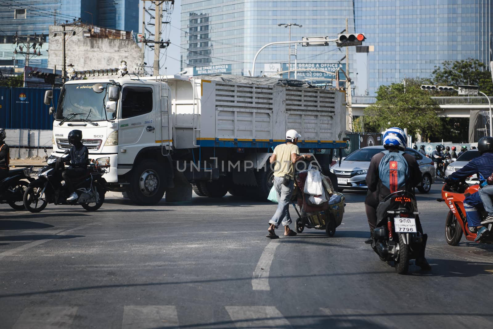 Bangkok, Thailand - January 6, 2020 : Cars on busy road in the Bangkok city, Thailand. Many cars use the street for transportation in rushhour with a traffic jam