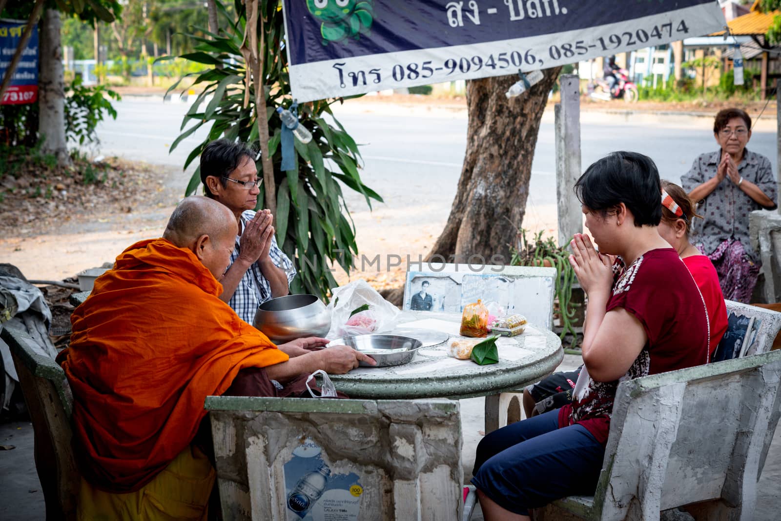 Ang Thong, Thailand - February 9, 2020 : Unidentified thai monk praying for religious ceremony in buddhist belief at Thai temple (Wat Thai)