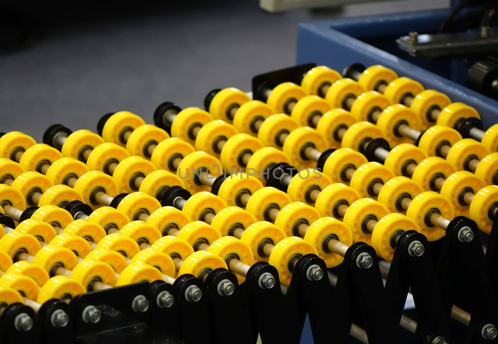Small yellow plastic rollers for transporting goods
