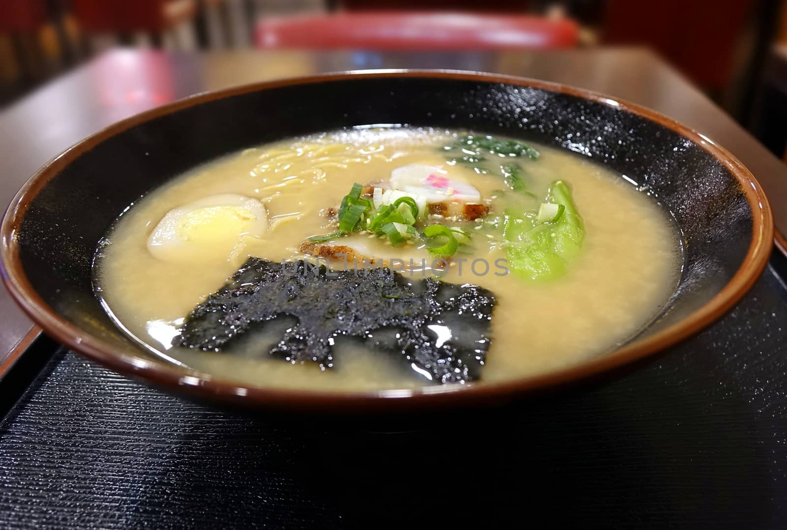 Japanese miso ramen noodles with seaweed, egg and vegetables