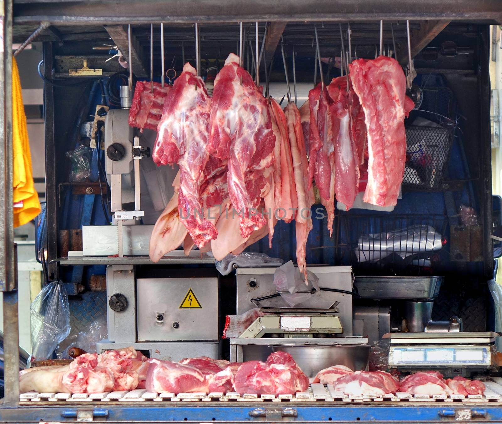A butcher store is set up on a small truck