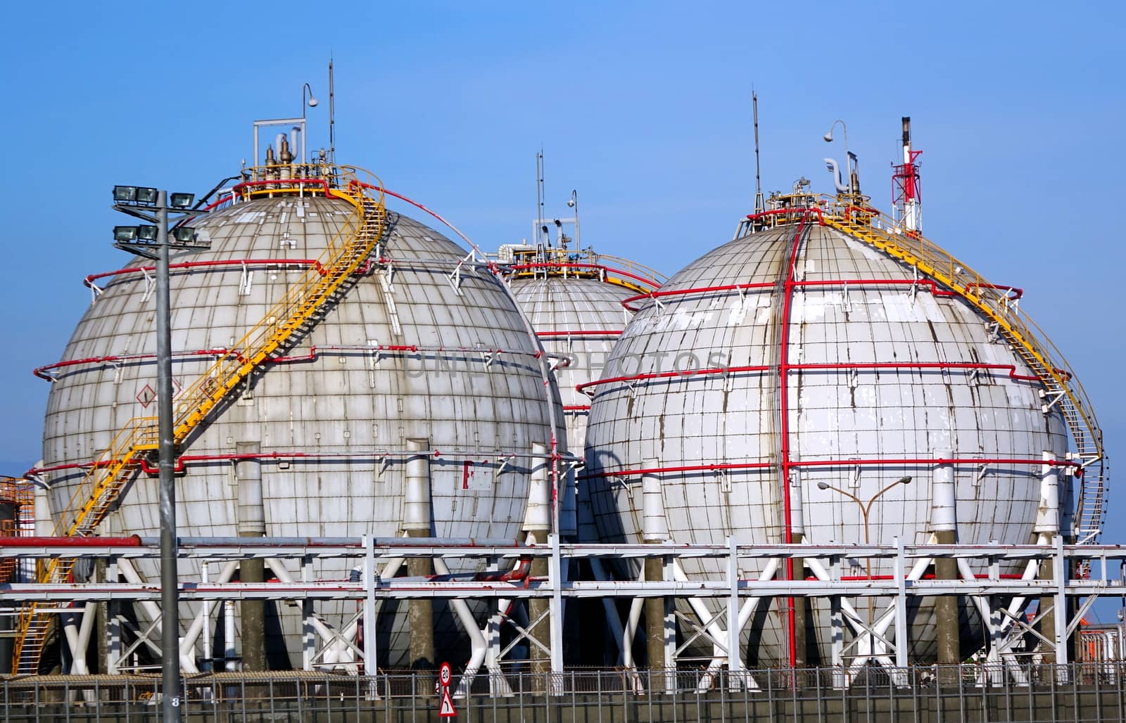 Large spherical fuel storage tanks with fuel pipes and ladders
