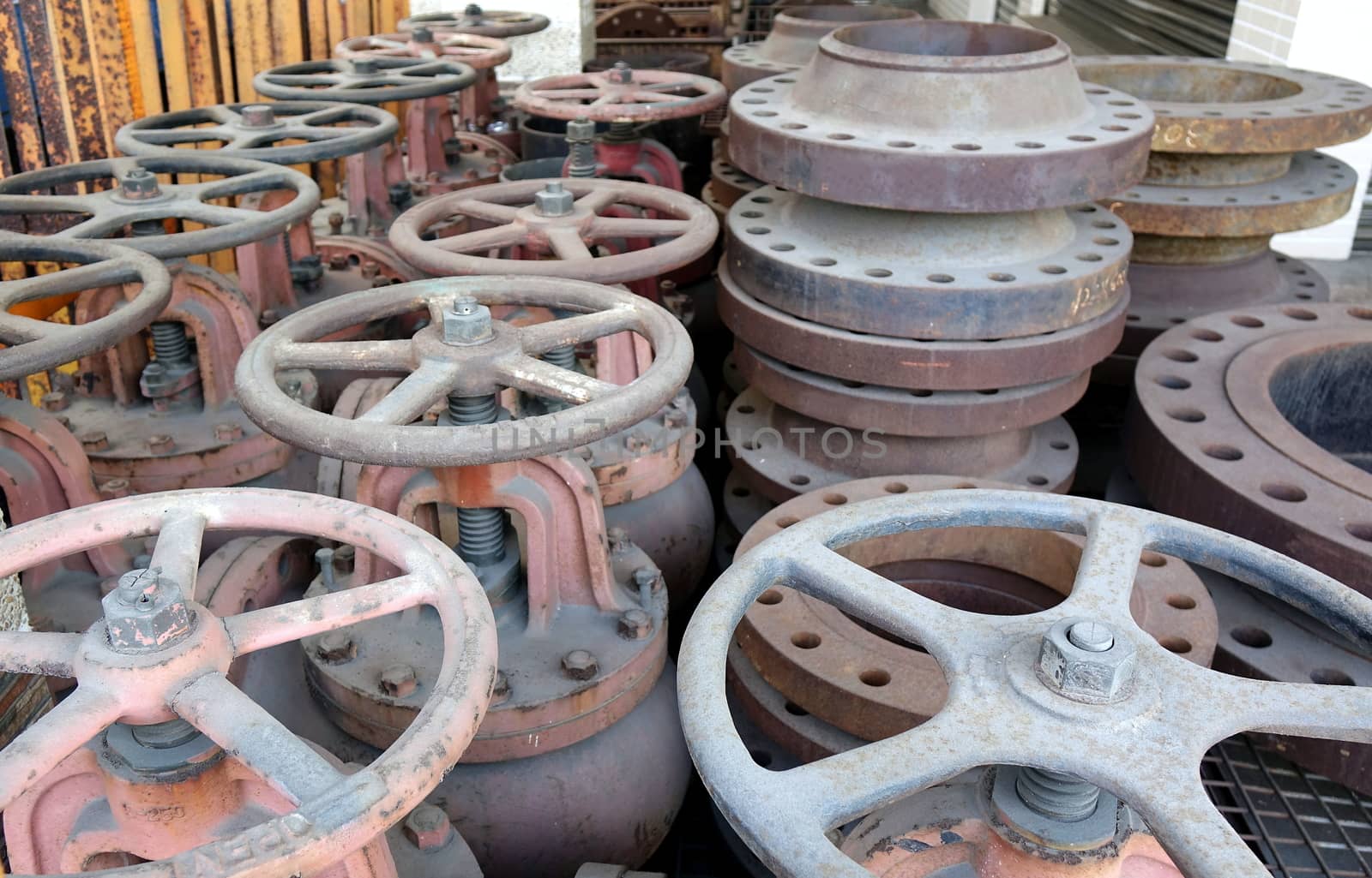A collection of massive ship valves with large handwheels
