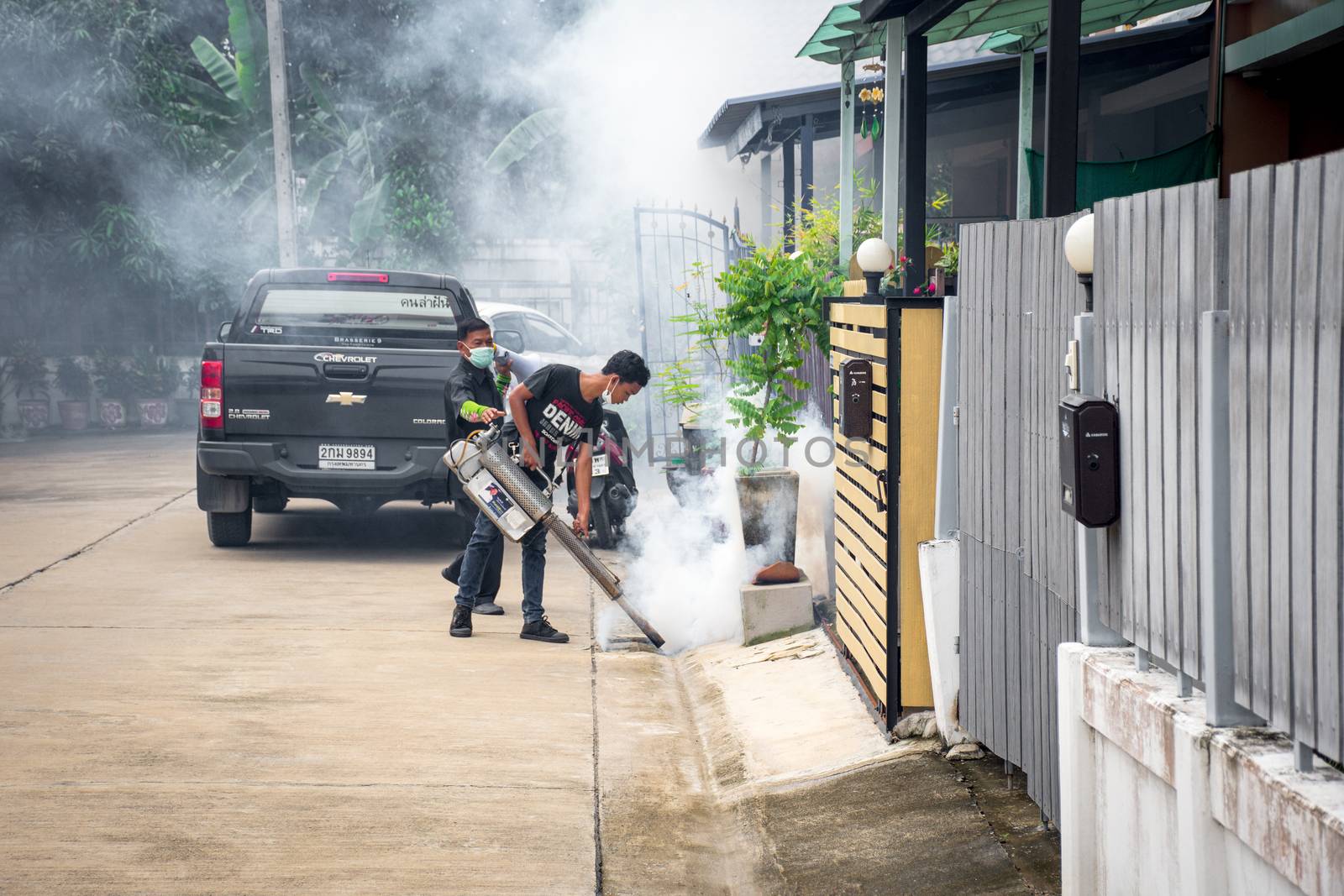 Bangkok, Thailand - July 3, 2016 : Unidentified people fogging DDT spray for mosquito kill and protect by control mosquito is a carrier of Malaria, Encephalitis, Dengue and Zika virus in village.