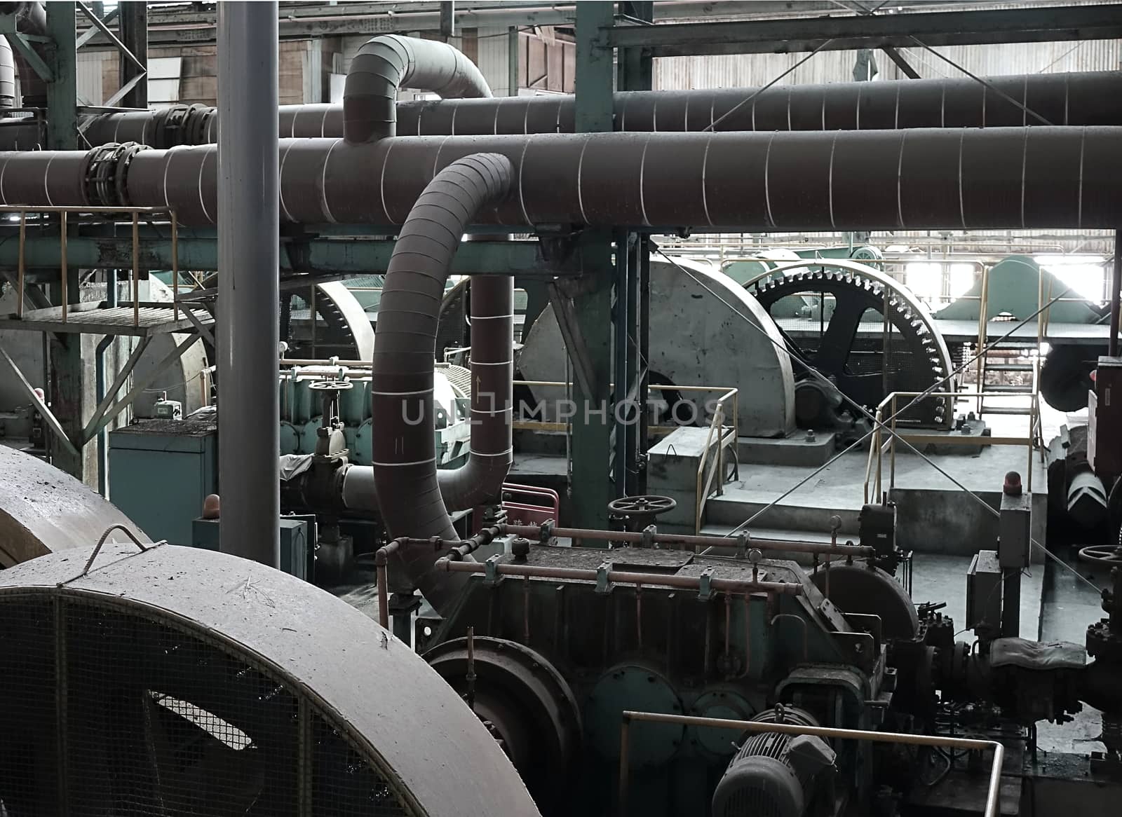 Rusting machinery and equipment in an abandoned old factory
